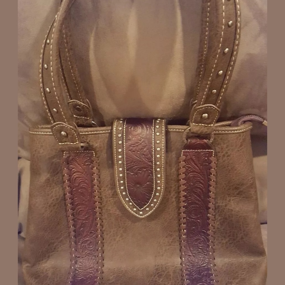 Trinity Ranch brown leather handbag should…